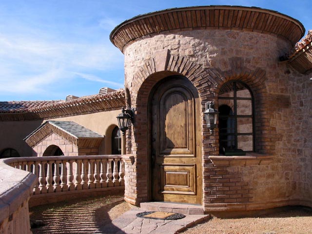 Ledge stone entry column with a natural stone cap