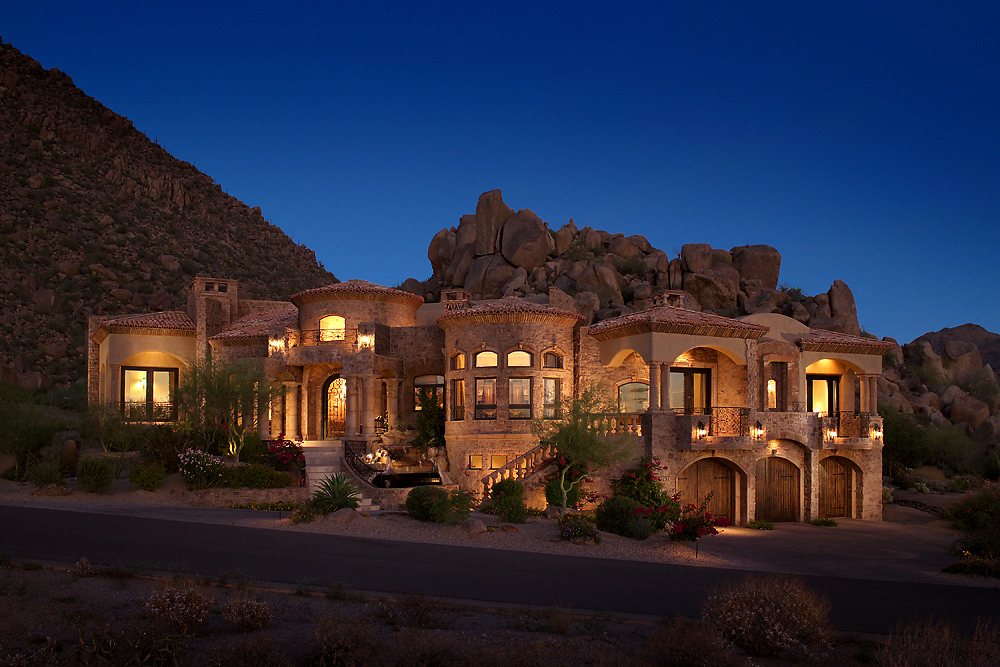 Dark stone facade with recessed lighting on a contemporary home exterior