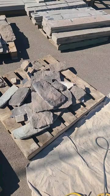 Cast stone pieces and cut caps stacked on pallets in the Tempe manufacturing yard